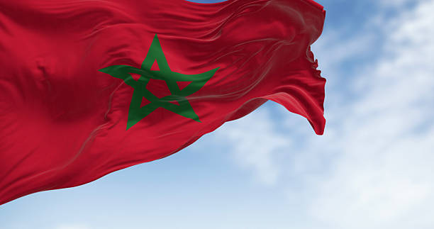 istock Morocco national flag waving in the wind on a clear day 2236942451