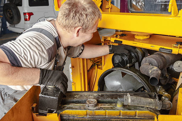 istock Mechanic Working on Heavy Machinery in Workshop 2236944410