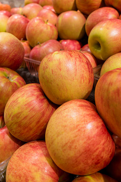 istock Glossy Apples Piled Up at the Market Display 2236945645