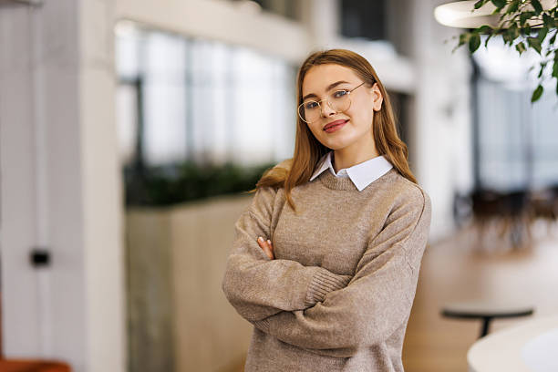 istock Confident pretty young manager in office 2236947054