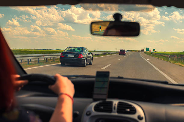 istock Woman driving car on the highway 2236947714
