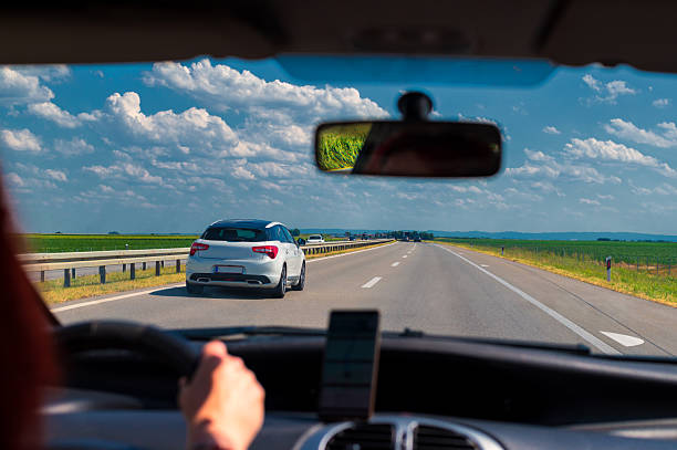 istock Woman driving car on the highway 2236948812