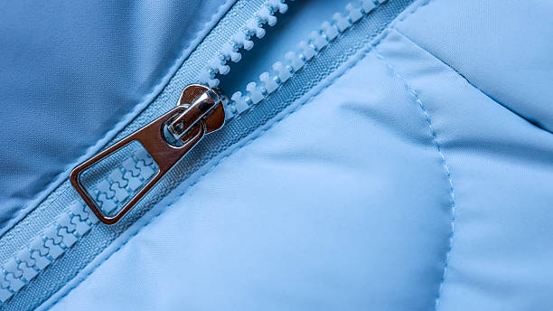 one white closed metallic zip on blue synthetic clothing fabric