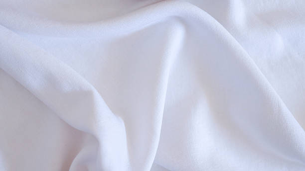 istock White fabric with soft folds and subtle shadows 2236954556