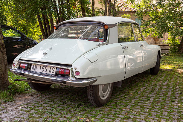 Citroën DS Decapotable classic convertible luxury car parked in the port of Monaco during a summer evening. The Citroën DS Décapotable was an exclusive open-top version of the legendary Citroën DS, produced between 1960 and 1971 by coachbuilder Henri Chapron. The convertible was largely hand-built and made in very limited numbers—fewer than 1,400 examples in total—making it one of the rarest and most desirable Citroëns ever created. The long, graceful body, chrome detailing, and uncluttered silhouette gave the car a refined presence that appealed to elite buyers, from celebrities to heads of state.