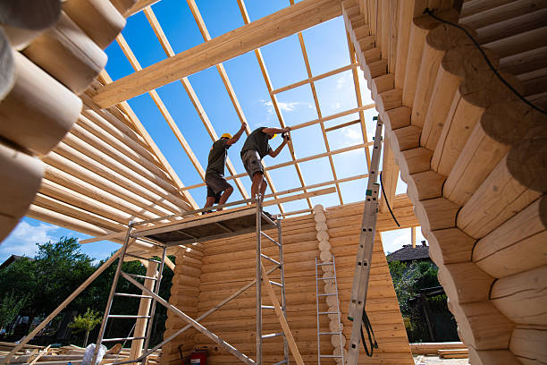 istock Team of professional builers work on building a log cabin. 2236955836