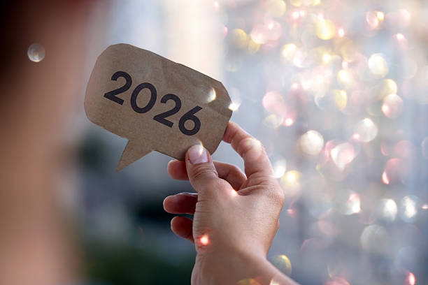 istock A hand holding a speech bubble cutout with 