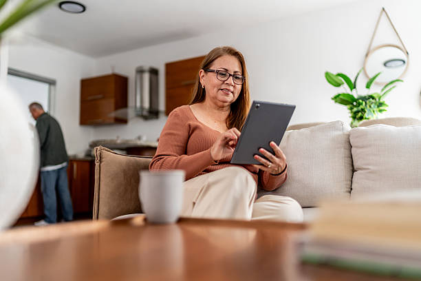 istock Senior woman using digital tablet at home 2236962573