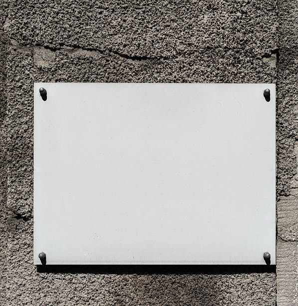 istock White plaque on stone wall, empty copy space, beautiful background for designer, mock-up 2236962665