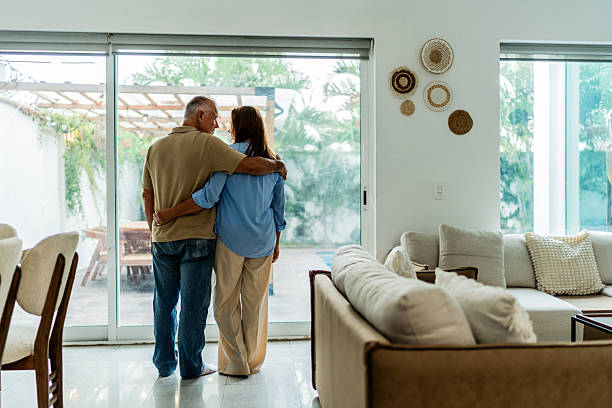 istock Senior couple talking embraced at home 2236962783