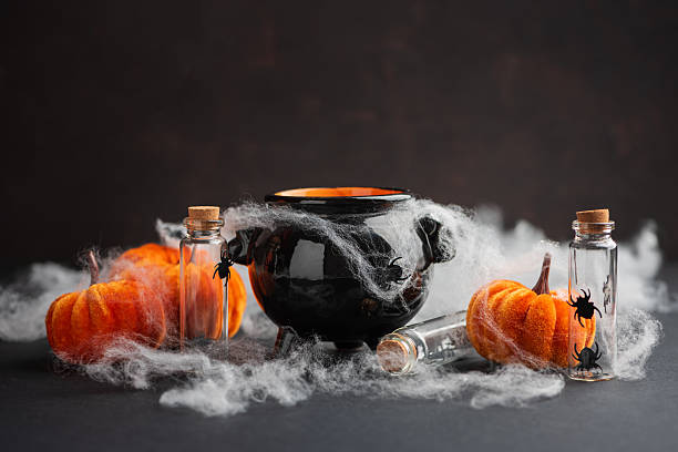 istock Halloween Cauldron with Pumpkins, Spiders and Cobwebs 2236964417