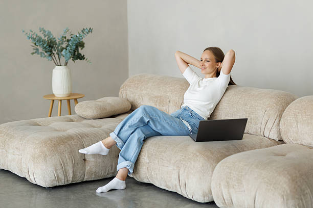 istock Cozy workplace. Relaxed freelancer woman working with laptop at home, free space 2236966094