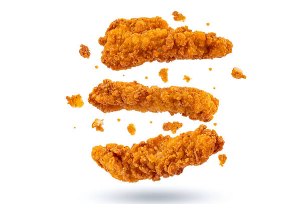 Fried chicken breast strips on white background. Isolated chicken crisps
