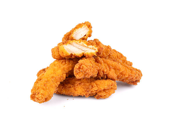 Fried chicken breast strips on white background. Isolated chicken crisps