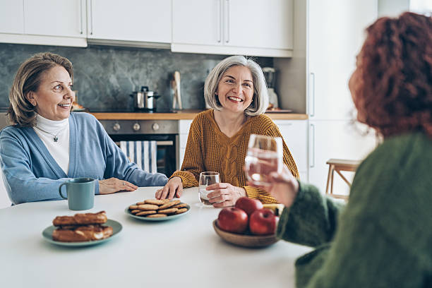 istock Small group of mature women talking at breakfast 2236976373