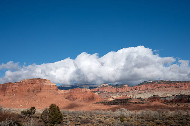 istock Cumulus Clouds over Red Rock Cliffs, Capitol Reef National Park 2236976656