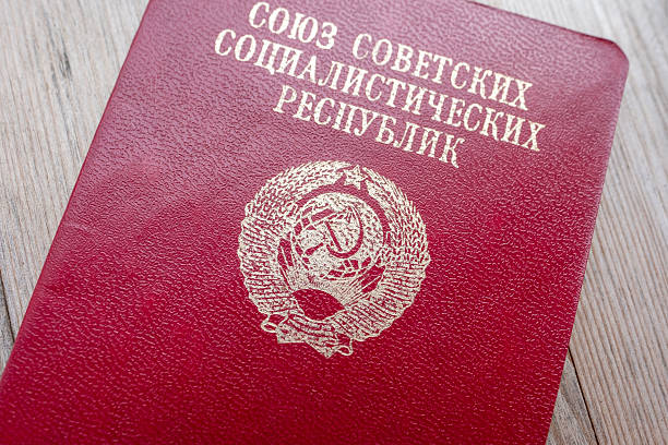 Close-up red USSR passport, Soviet emblem, historical document vintage red cover Union Soviet Socialist Republics passport, Historical document from the Soviet era, political system communism