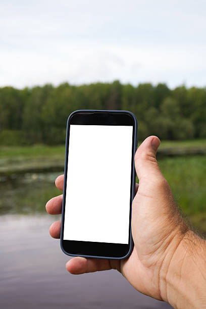 istock Hand holding smartphone with blank screen outdoors 2236980387