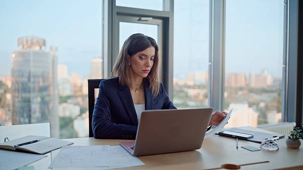 istock Focused executive typing laptop by modern office panoramic window closeup. 2236981876
