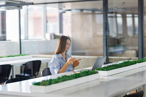 istock Cheerful business lady working on laptop in office 2236982185
