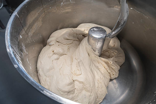 istock Bread Dough Mixing in Industrial Stainless Steel Bowl 2236986109