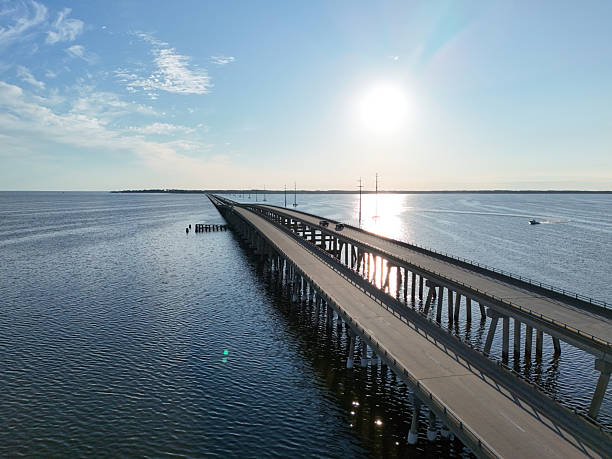 istock Long Wright Memorial Bridge Extends Into Calm Sea Under Clear Sky, A Serene Coastal Scene 2236986816