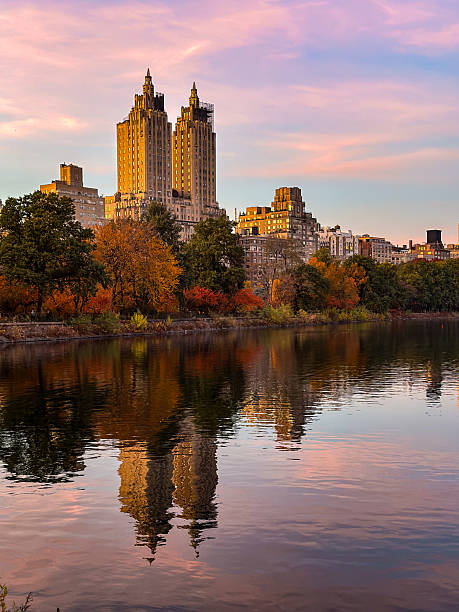 istock fall landscape, buildings reflected in the NYC reservoir at Central Park 2236987042
