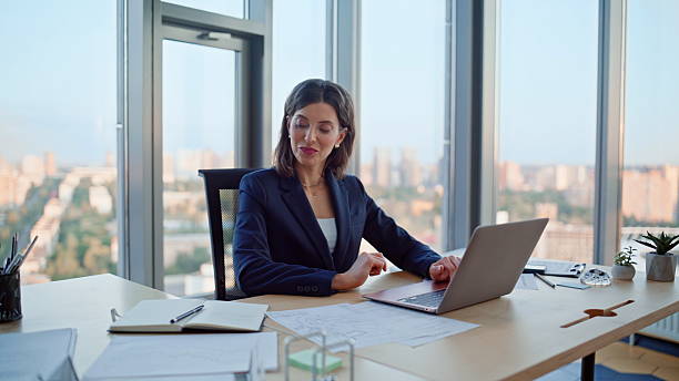istock Smiling employee working computer enjoying successful project. Happy woman 2236988943