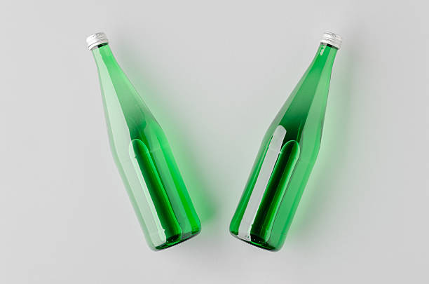 Large green empty glass bottle isolated on white.