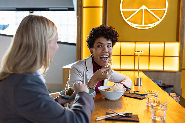 istock Friends are eating at a stylish Asian restaurant 2236991176