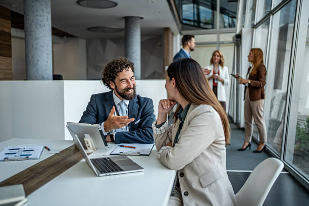 istock Business colleagues collaborating during a corporate office meeting 2236991229