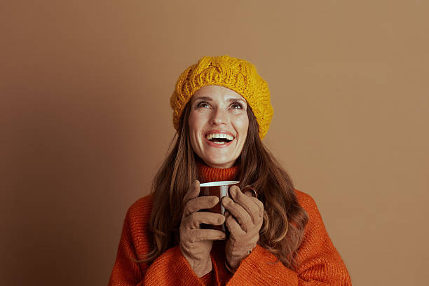 istock Joyful Woman Looking Upward, Embracing Warmth 2236992833