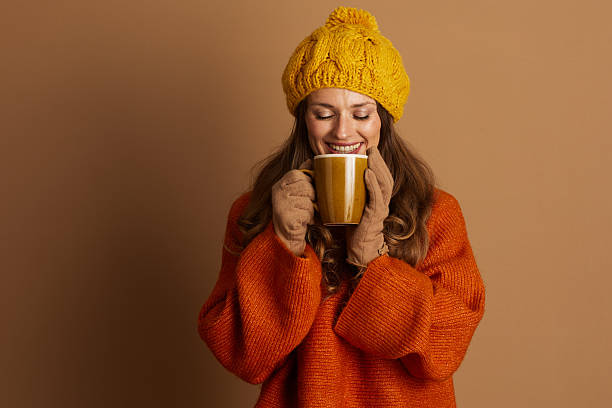 istock Content Woman Enjoying Warm Mug in Beanie 2236992857