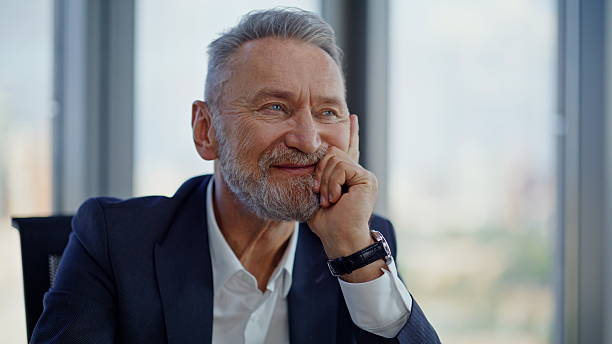 istock Successful manager dreaming retire sitting by office panoramic window closeup. 2236993139