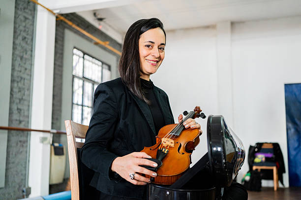Portrait of a violinist on a music studio