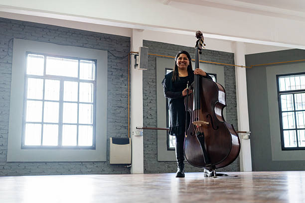 Musician playing cello on a music studio