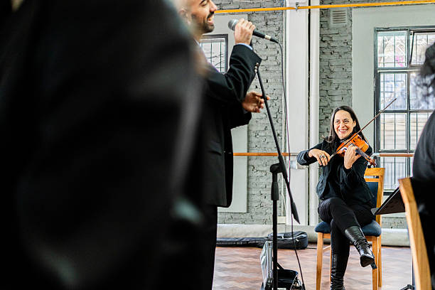 Musician playing violin on a music studio