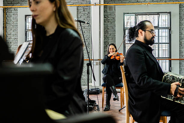 Portrait of a musician playing violin on a music studio