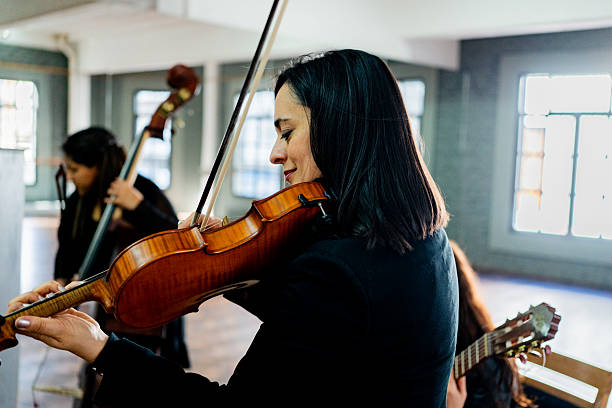 istock Musician playing with orchestra on a music studio 2236995513