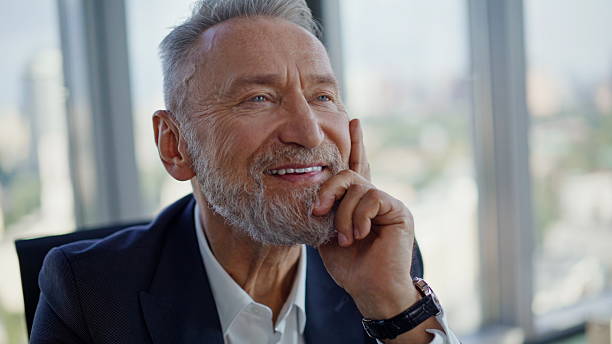 istock Wealthy executive thinking success sitting light corporate workplace closeup. 2236997162