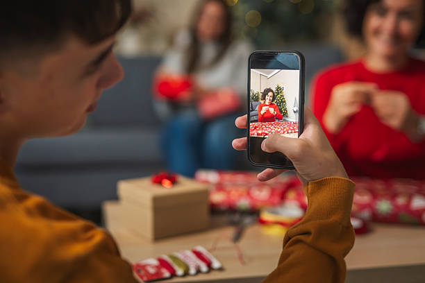 istock Family connecting virtually celebrating christmas wrapping gifts 2236998842