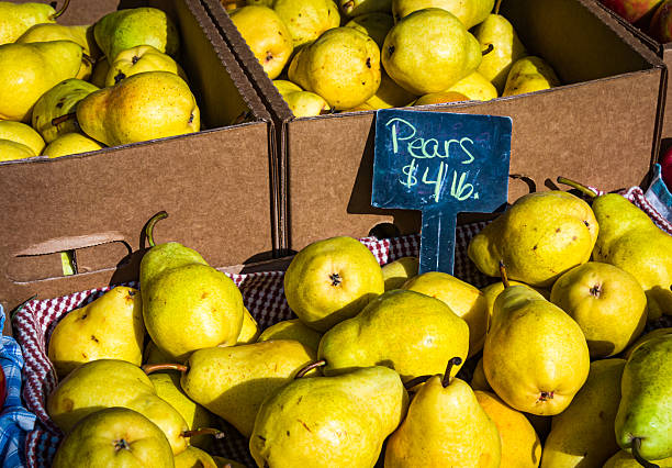 Boxes of fresh local yellow pears are displayed at a weekly Cape Cod farmer's Market in late September.