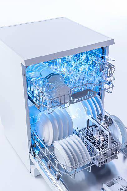 istock Dishwasher opening with clean dishes and glowing UV light 2237004738