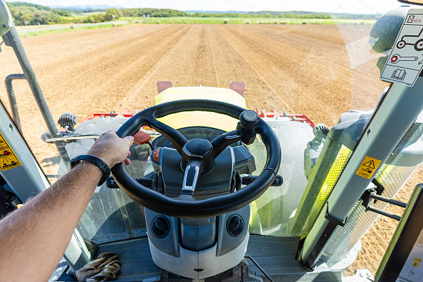 A POV from drivers perspective operating a large tractor on a farm field in north Hokkaido.