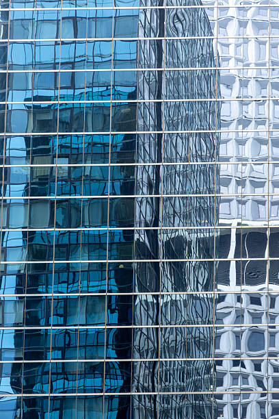 istock Urban abstract: window facade of a downtown office building with reflections and colors 2237005553
