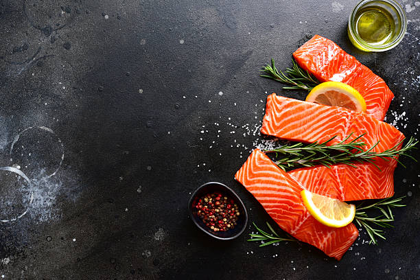 istock Raw fresh organic trout fillet with ingredients for cooking . Top view with copy space. 2237007007