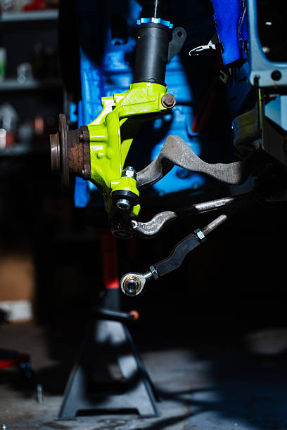 istock Front Suspension and Brake Disc Installation. Performance brake disc and strut assembly installed for drift stopping power. Disc brake and coilover strut setup being fine-tuned for drift racing. 2237009881