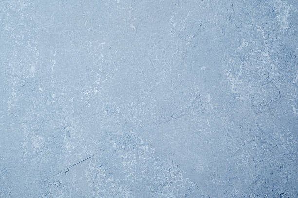 istock Light blue wall with smooth grunge plaster and faded surface texture 2237014139
