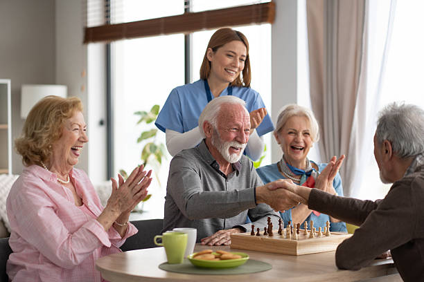 istock Seniors Celebrating a Chess Victory with Applauding Nurse 2237014670