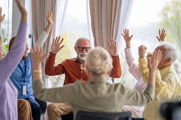 istock Seniors in Wheelchairs Participating in a Dynamic Session 2237014680